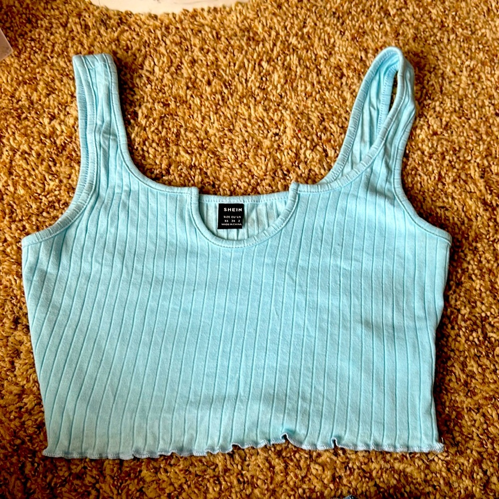 I’m new to poshmark and for my first piece i’m selling this blue crop top.